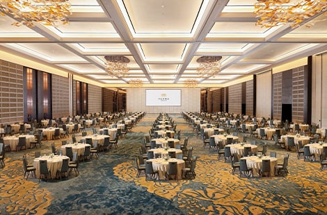 Large 5-star hotel ballroom with luxurious chandeliers and table set up at Pandanaran Grand Ballroom