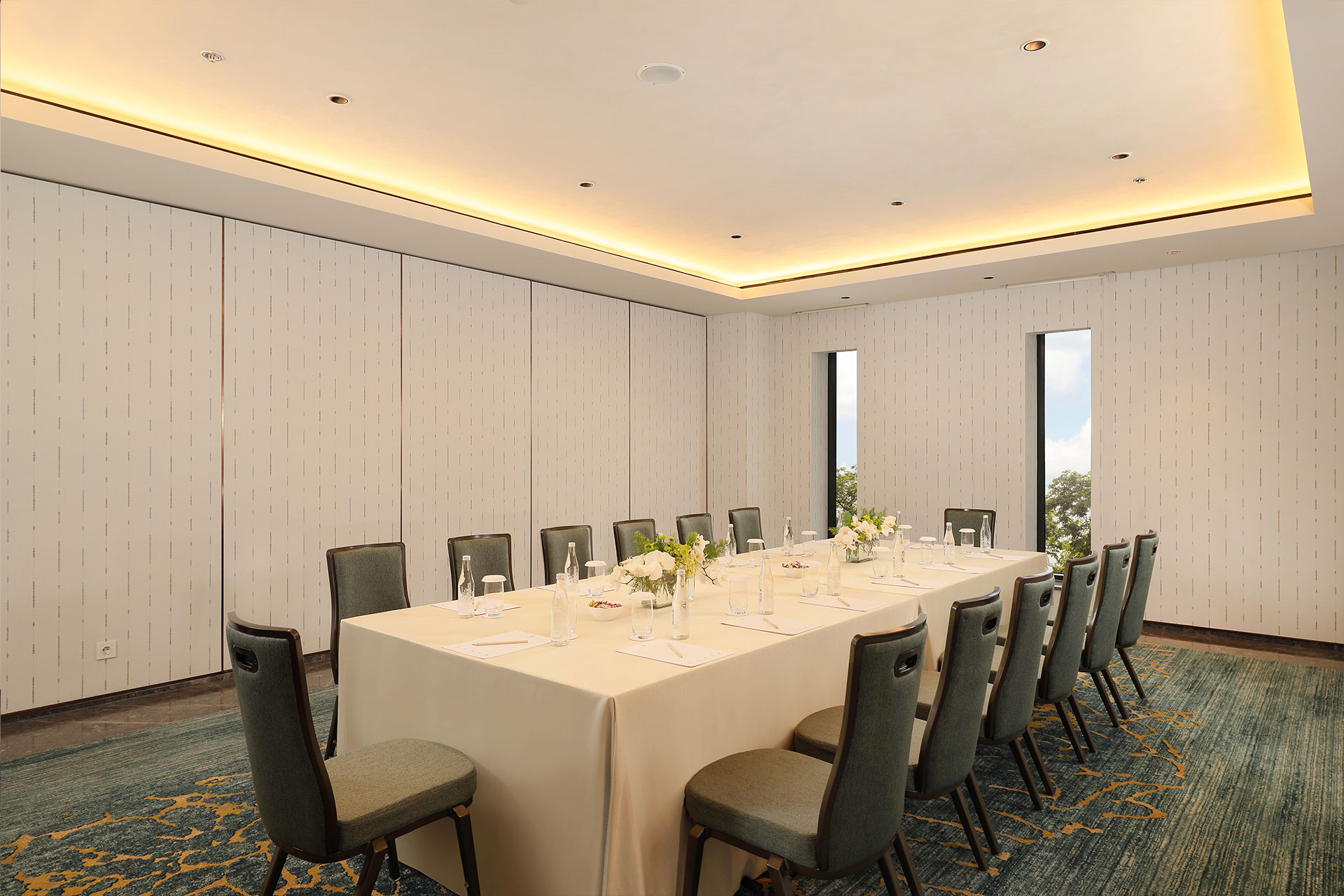 Luxurious indoor venue for meeting and private event with green view and board room set up