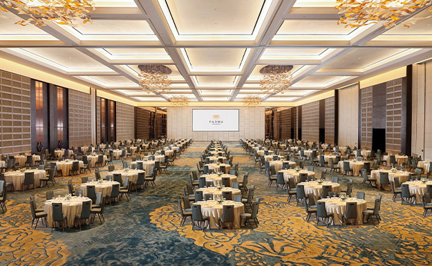 Large 5-star hotel ballroom with luxurious chandeliers and table set up at Pandanaran Grand Ballroom